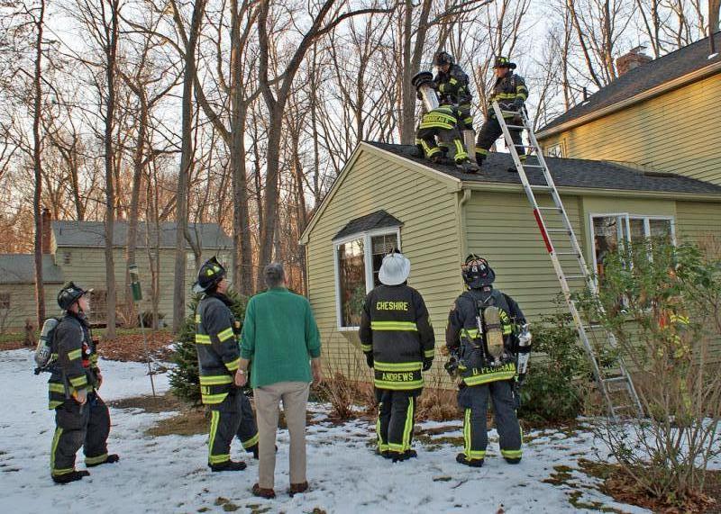 January 30, 2016: Cheshire firefighters inspect the metal chimney of a residence at 25 Arrowleaf Court after being notified of a chimney fire at this location. 
