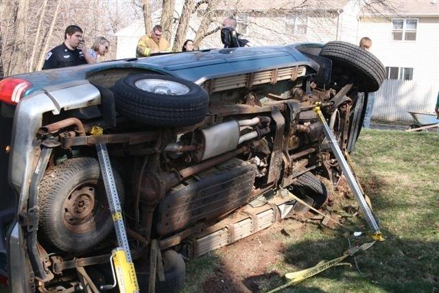 Cheshire Fire Fighters had to stabilize this motor vehicle after it rolled onto its side on Academy Road.