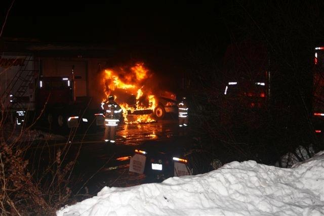 Cheshire Fire Fighters prepare to extinguish this well involved tractor trailer truck on Sandbank Road.